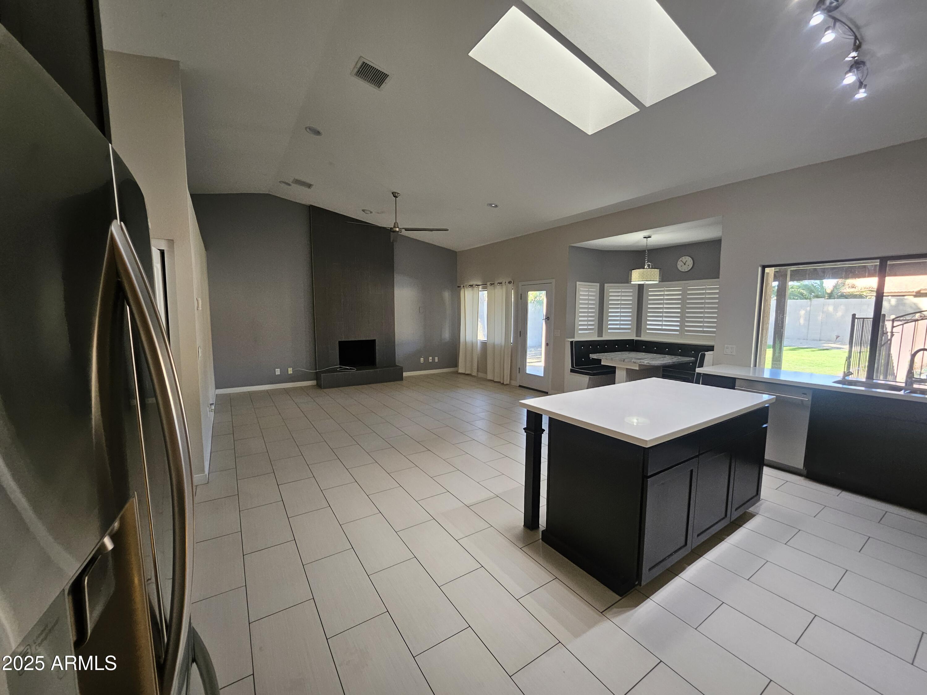 6002 East Marconi Avenue Scottsdale, AZ 85254 - Photo 5 of 29 a kitchen with stainless steel appliances granite countertop a refrigerator and a stove