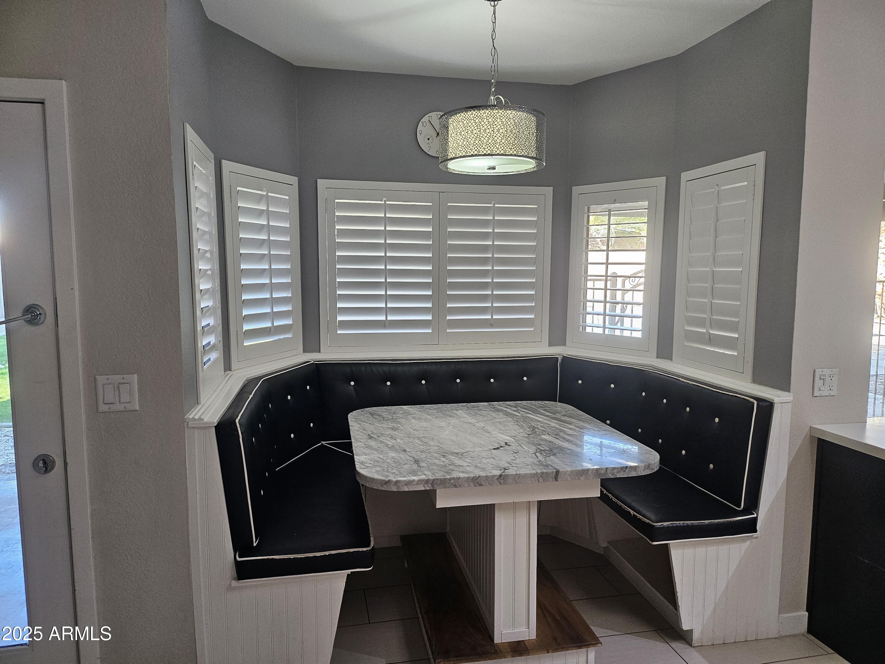 6002 East Marconi Avenue Scottsdale, AZ 85254 - Photo 9 of 29 a room with chandelier furniture and window
