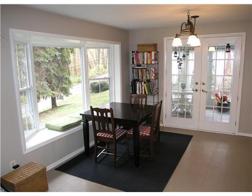 139 Oakhurst Road Pittsburgh, PA 15215 - Photo 5 of 16 Dining Room. A large bay window bathes the dining room in natural light. Double doors walk out to the screened-in porch.