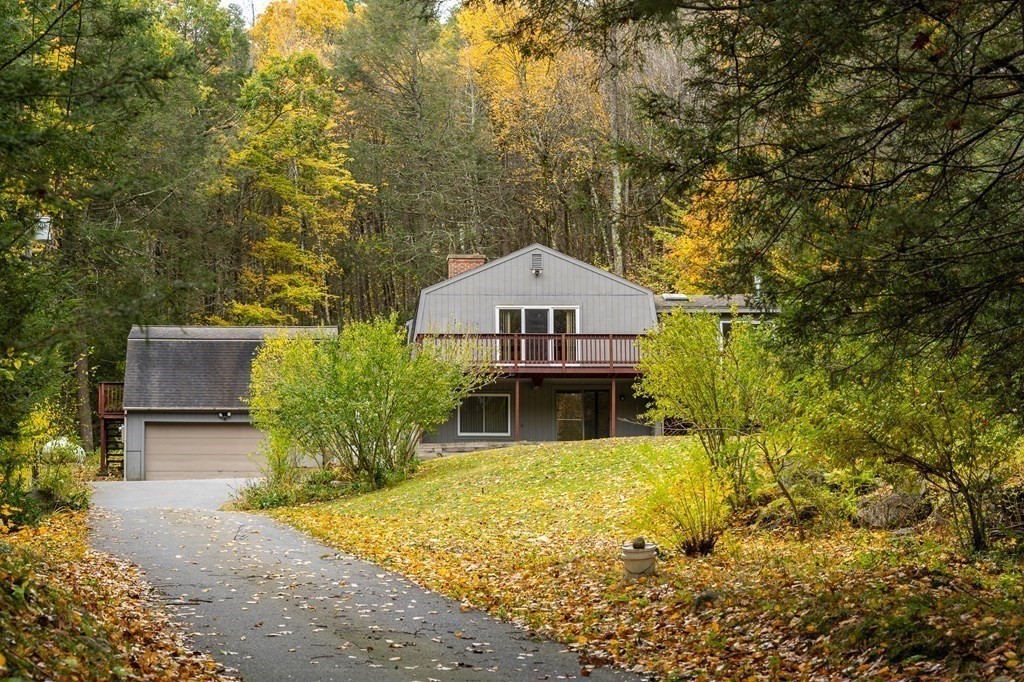 137 Fomer Road Southampton, MA 01073 - Photo 3 of 42 a view of a house with large trees and plants