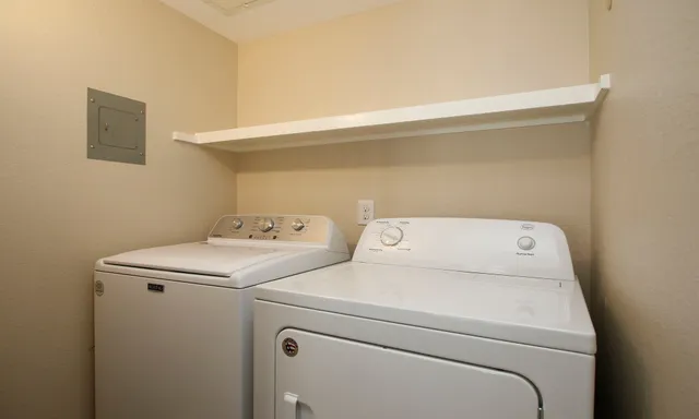 a utility room with dryer and washer