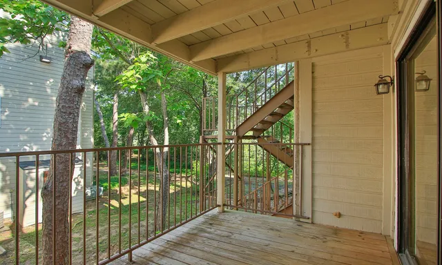 a view of balcony with wooden floor