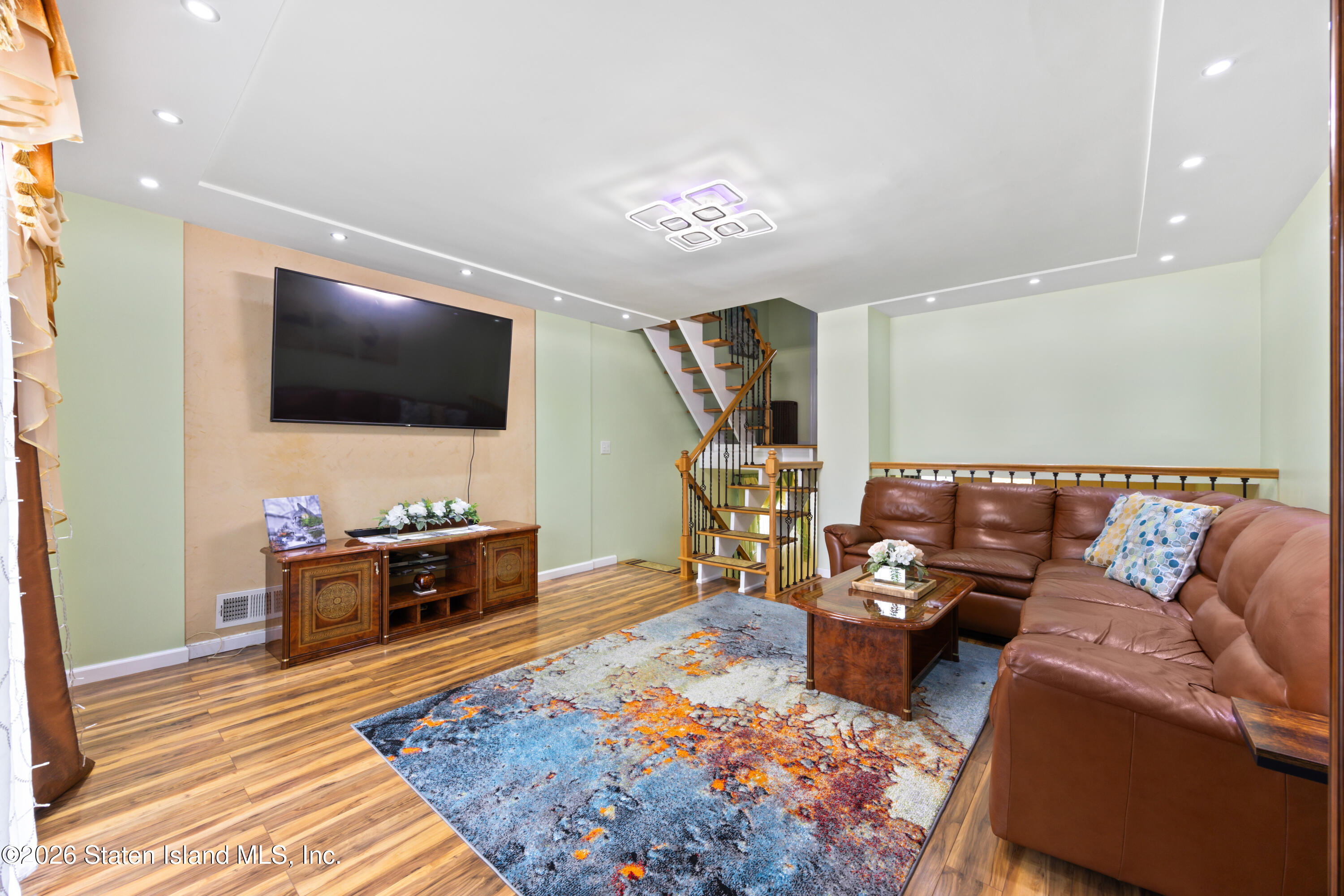 23 Stack Drive Staten Island, NY 10312 - Photo 12 of 29 a living room with furniture and a flat screen tv