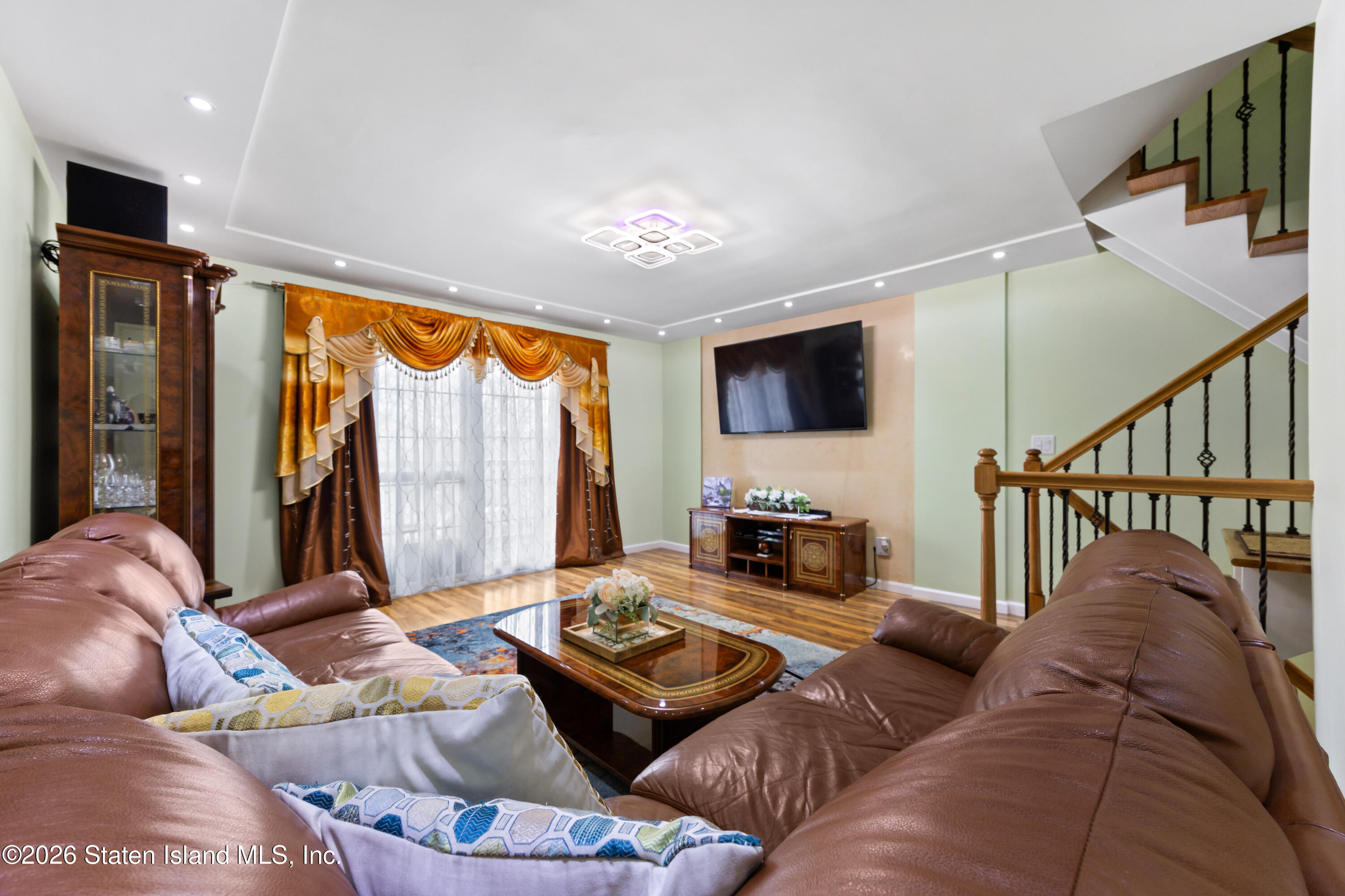 23 Stack Drive Staten Island, NY 10312 - Photo 13 of 29 a living room with furniture flat screen tv and a large window
