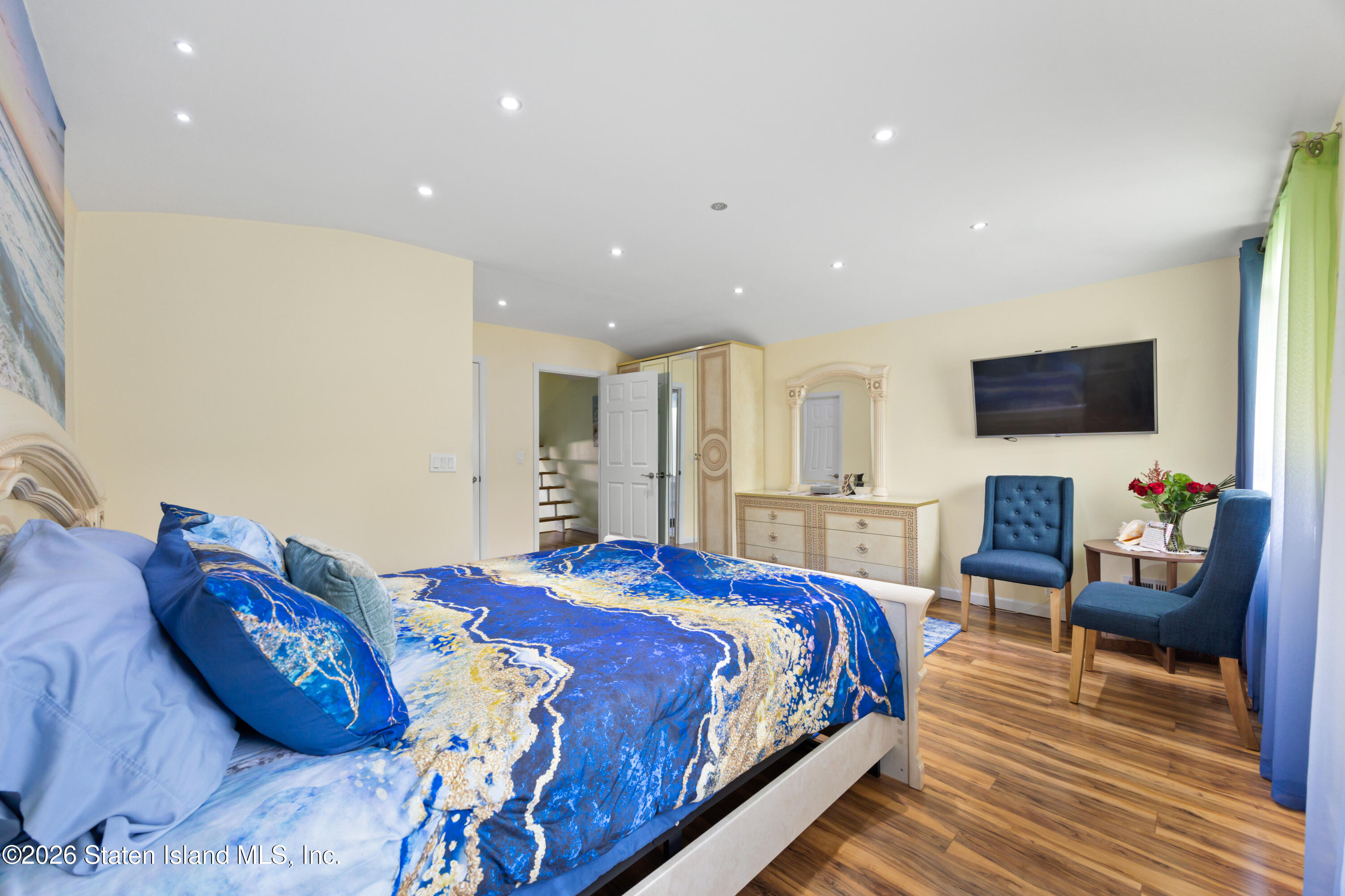 23 Stack Drive Staten Island, NY 10312 - Photo 16 of 29 a bedroom with a bed and wooden floor