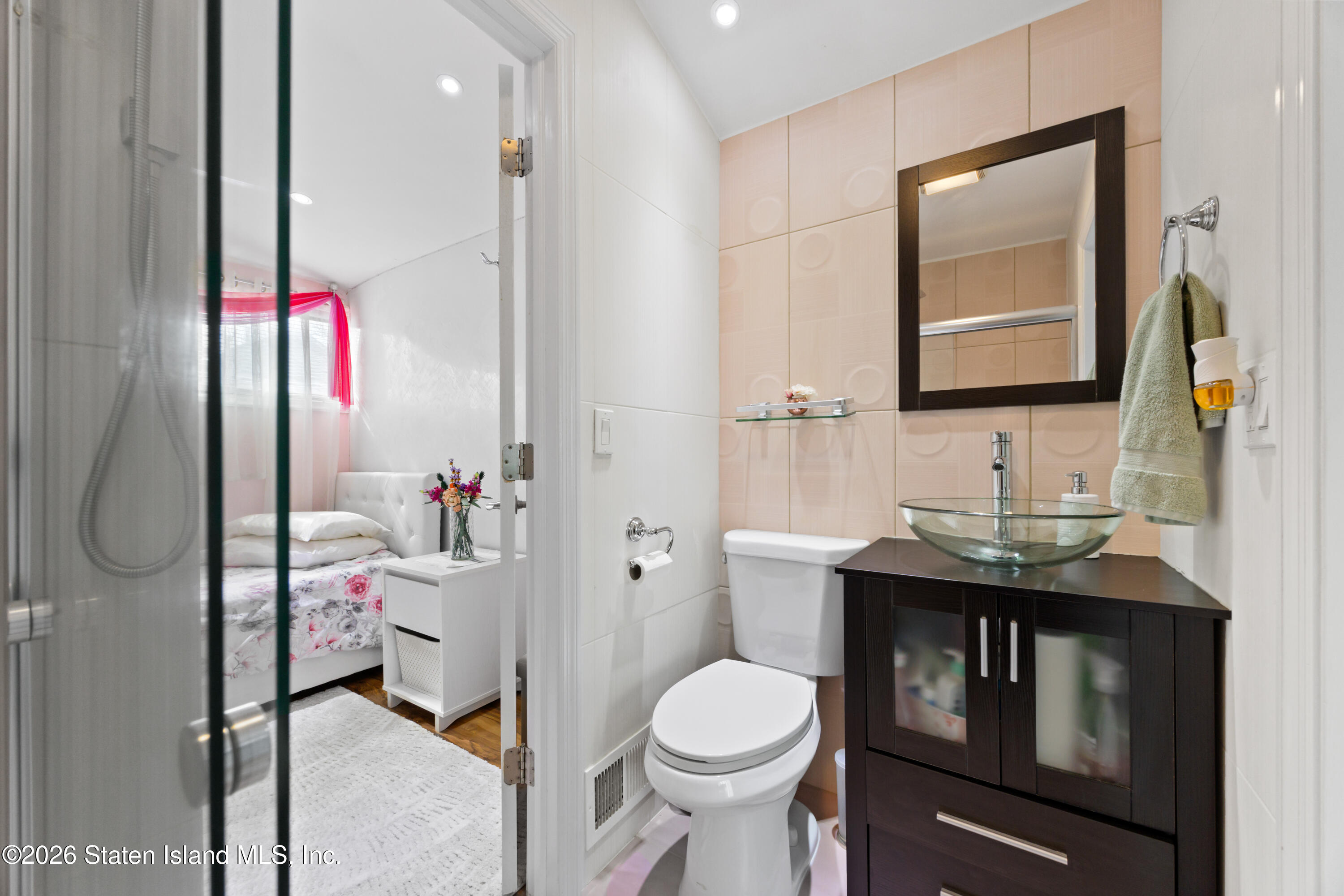 23 Stack Drive Staten Island, NY 10312 - Photo 20 of 29 a bathroom with a granite countertop sink mirror vanity and toilet