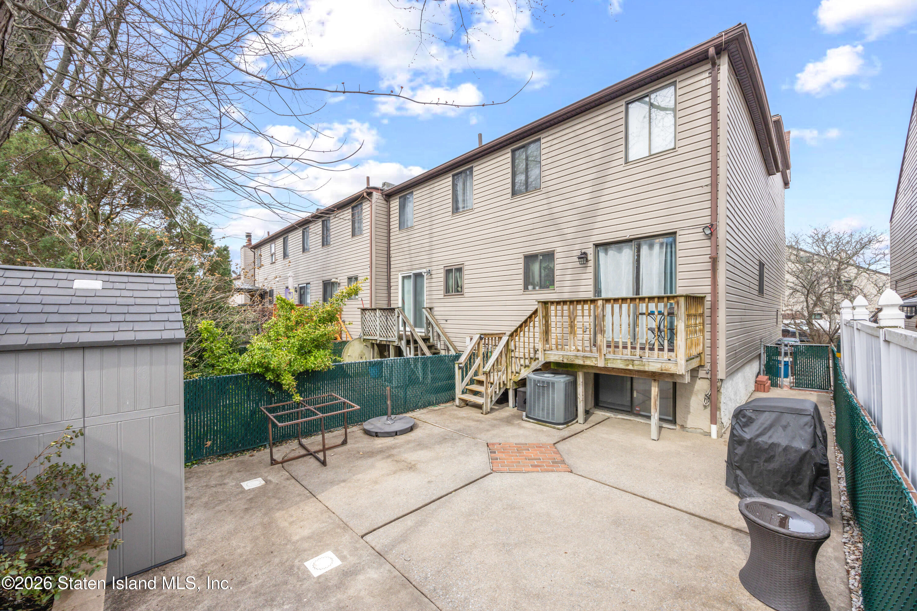 23 Stack Drive Staten Island, NY 10312 - Photo 25 of 29 a view of a house with backyard and sitting area