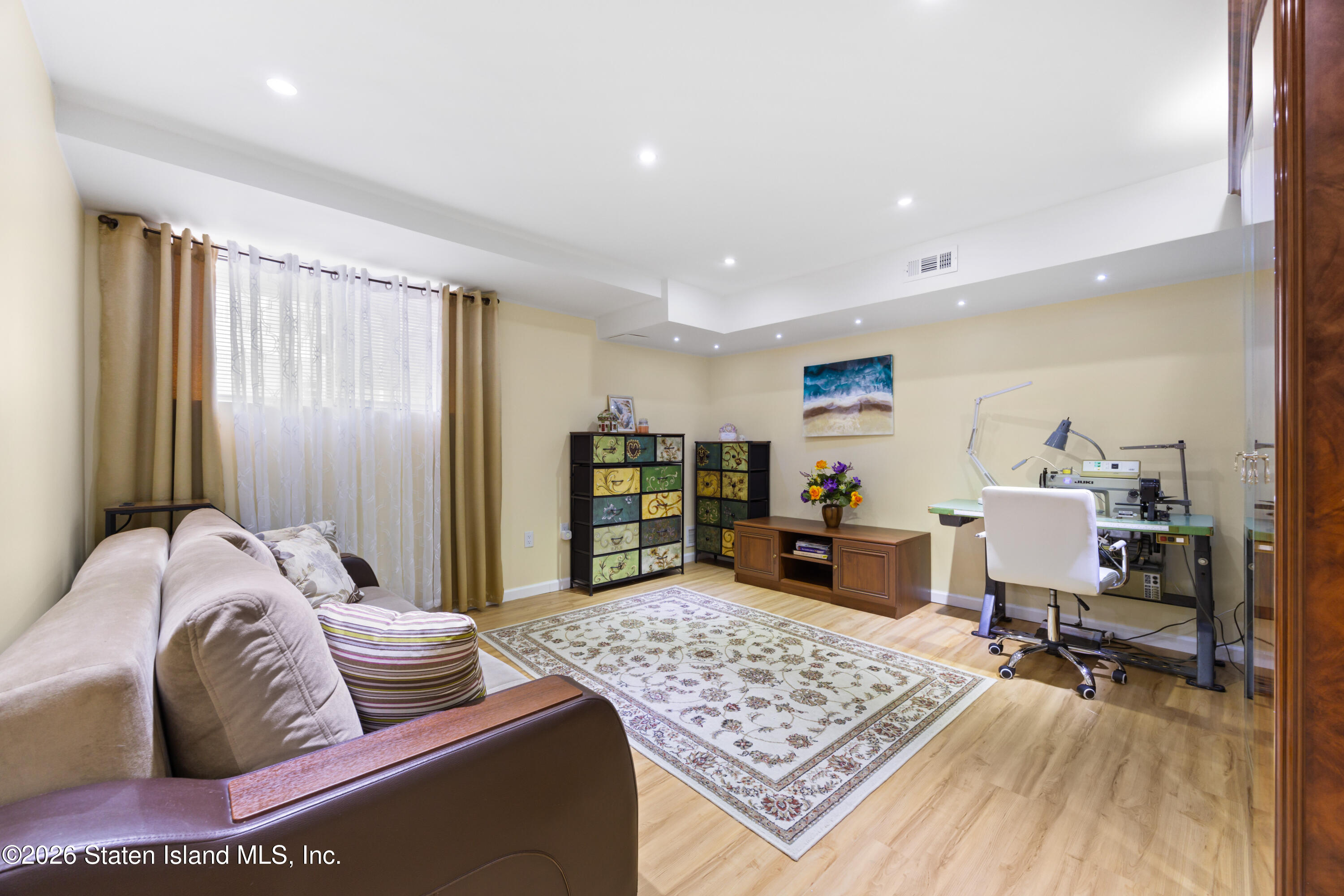 23 Stack Drive Staten Island, NY 10312 - Photo 4 of 29 a living room with furniture and a wooden floor