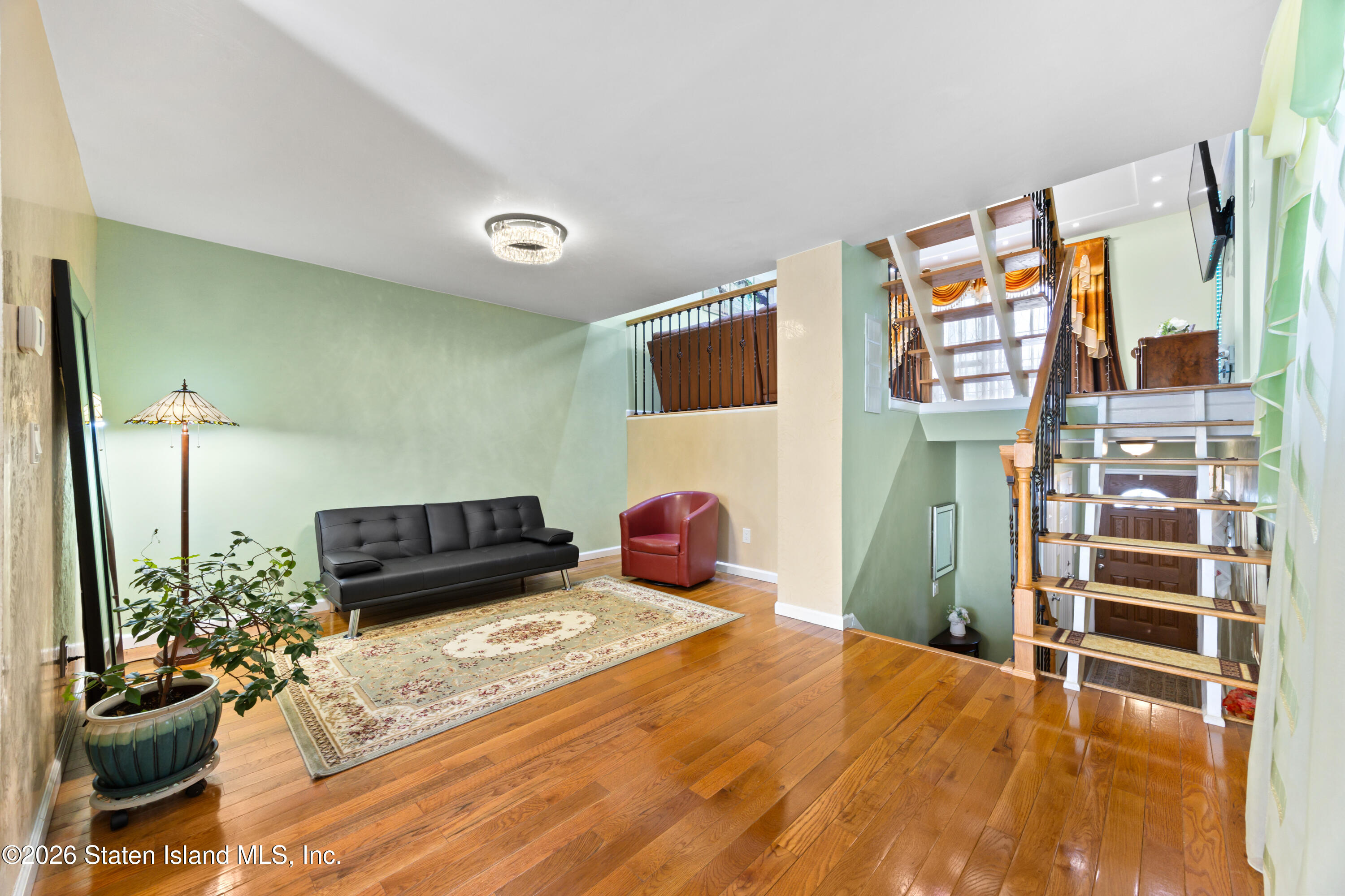 23 Stack Drive Staten Island, NY 10312 - Photo 6 of 29 a bedroom with a bed and a flat screen tv