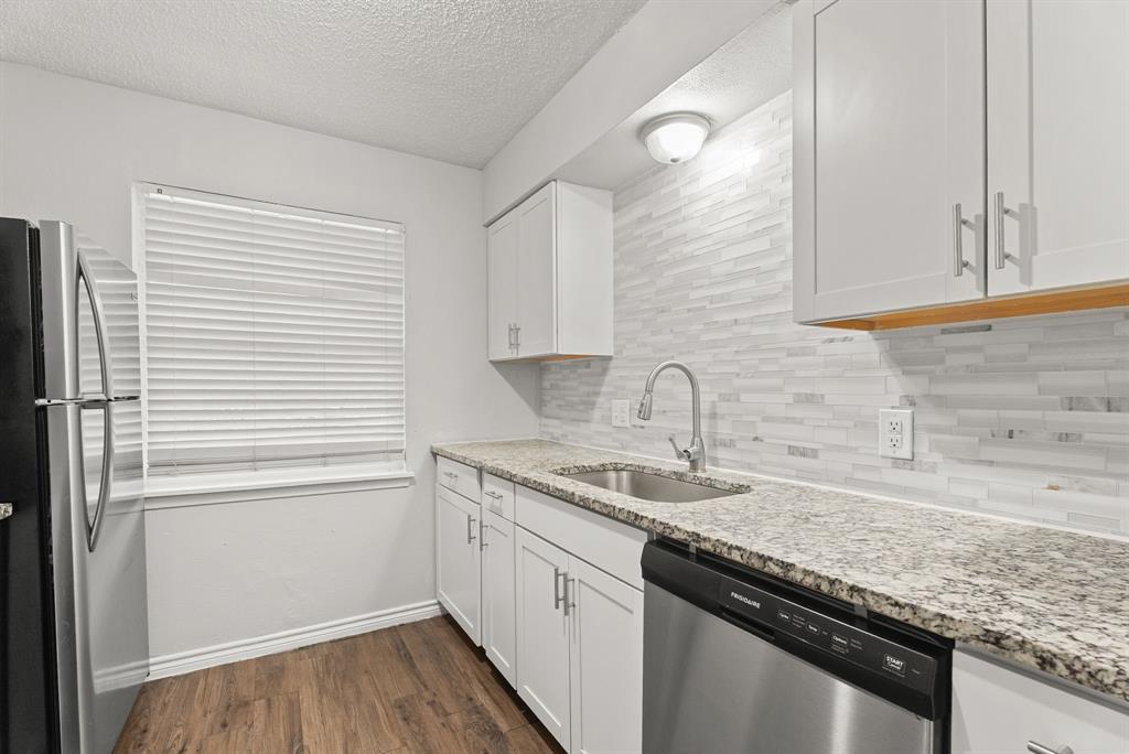 429 Johnson Street, Unit 10 Longview, TX 75602 - Photo 3 of 12 a kitchen with a sink and cabinets