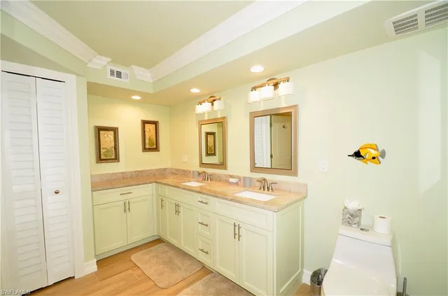 a spacious bathroom with a granite countertop sink and a mirror