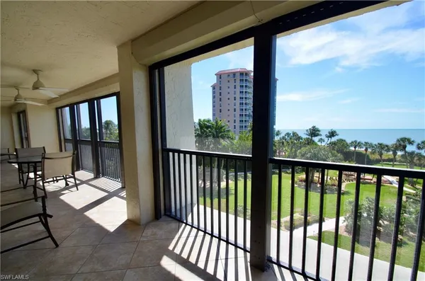 a view of a chairs and table in patio