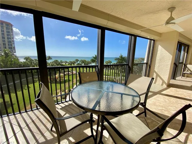 a view of a hallway with a glass door and a glass door
