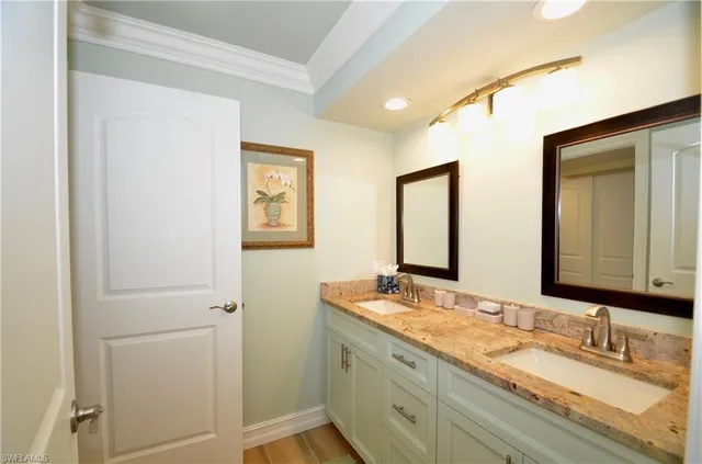 a bathroom with 2 sink and a mirror