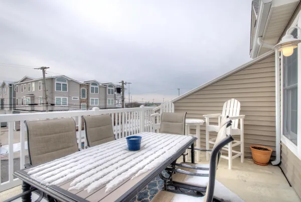 a porch with wooden floor