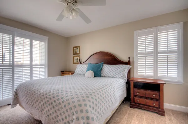 a bedroom with a bed and a lamp