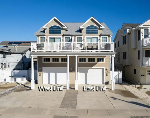 an aerial view of a house with roof deck