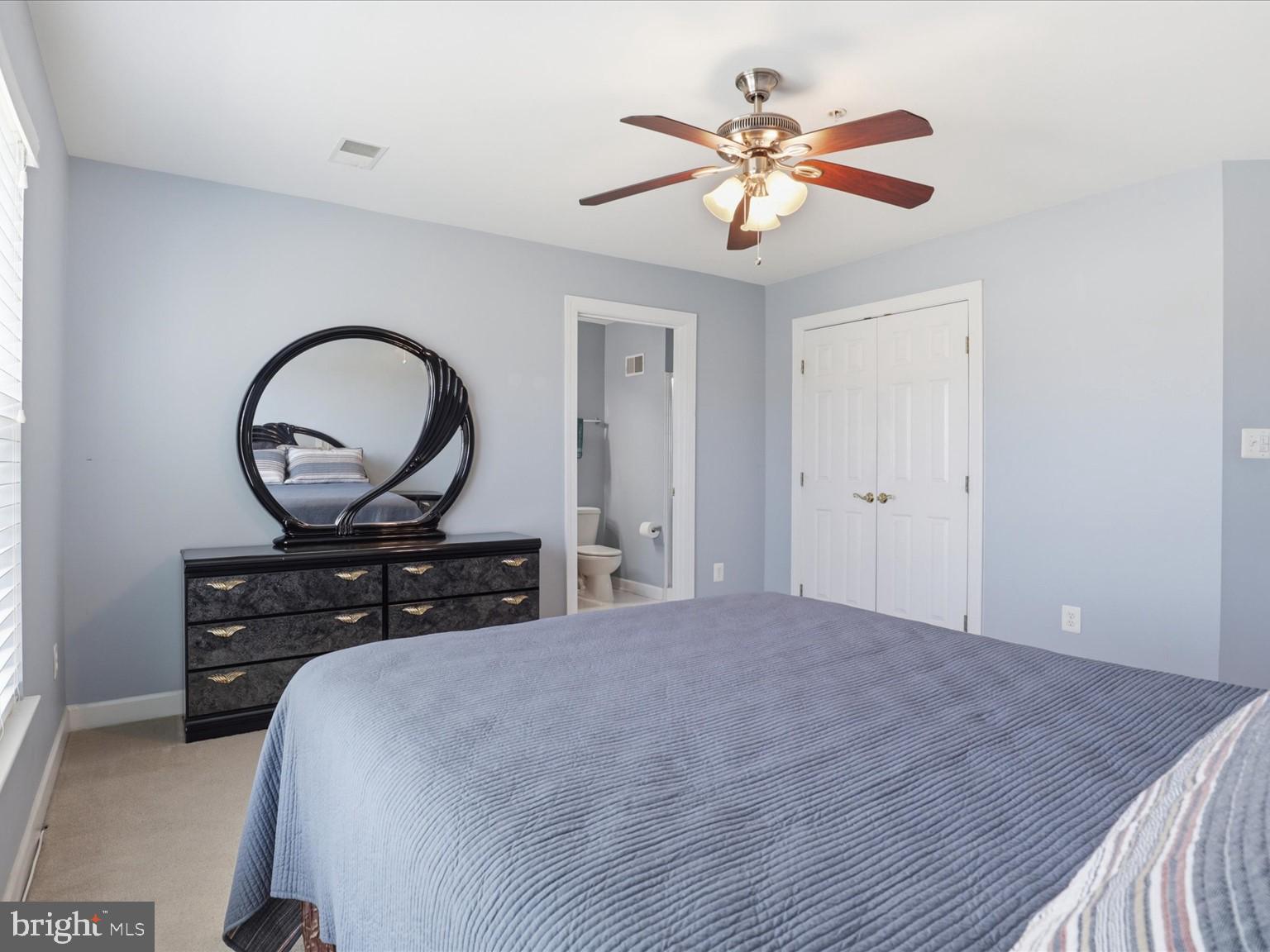 14202 Derby Ridge Road Bowie, MD 20721 - Photo 33 of 57 GUEST BEDROOM WITH CEILING FAN AND LIGHT FIXTURE