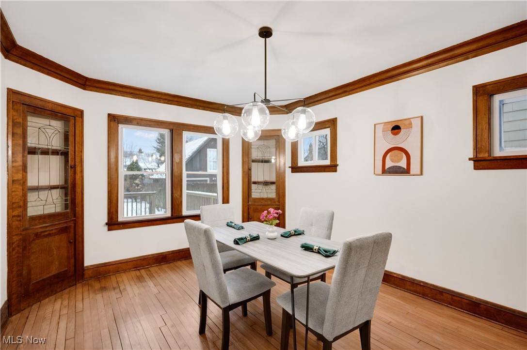 2016 Rossmoor Road Cleveland Heights, OH 44118 - Photo 14 of 46 Dining area with ornamental molding and wood-type flooring