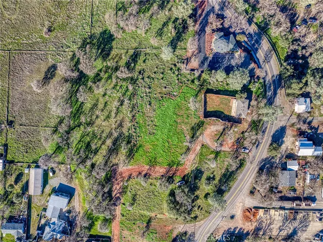 an aerial view of residential building and car parked