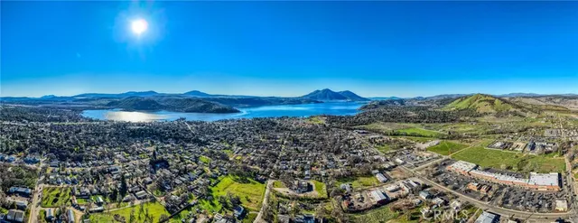 a view of a road with a house in the background