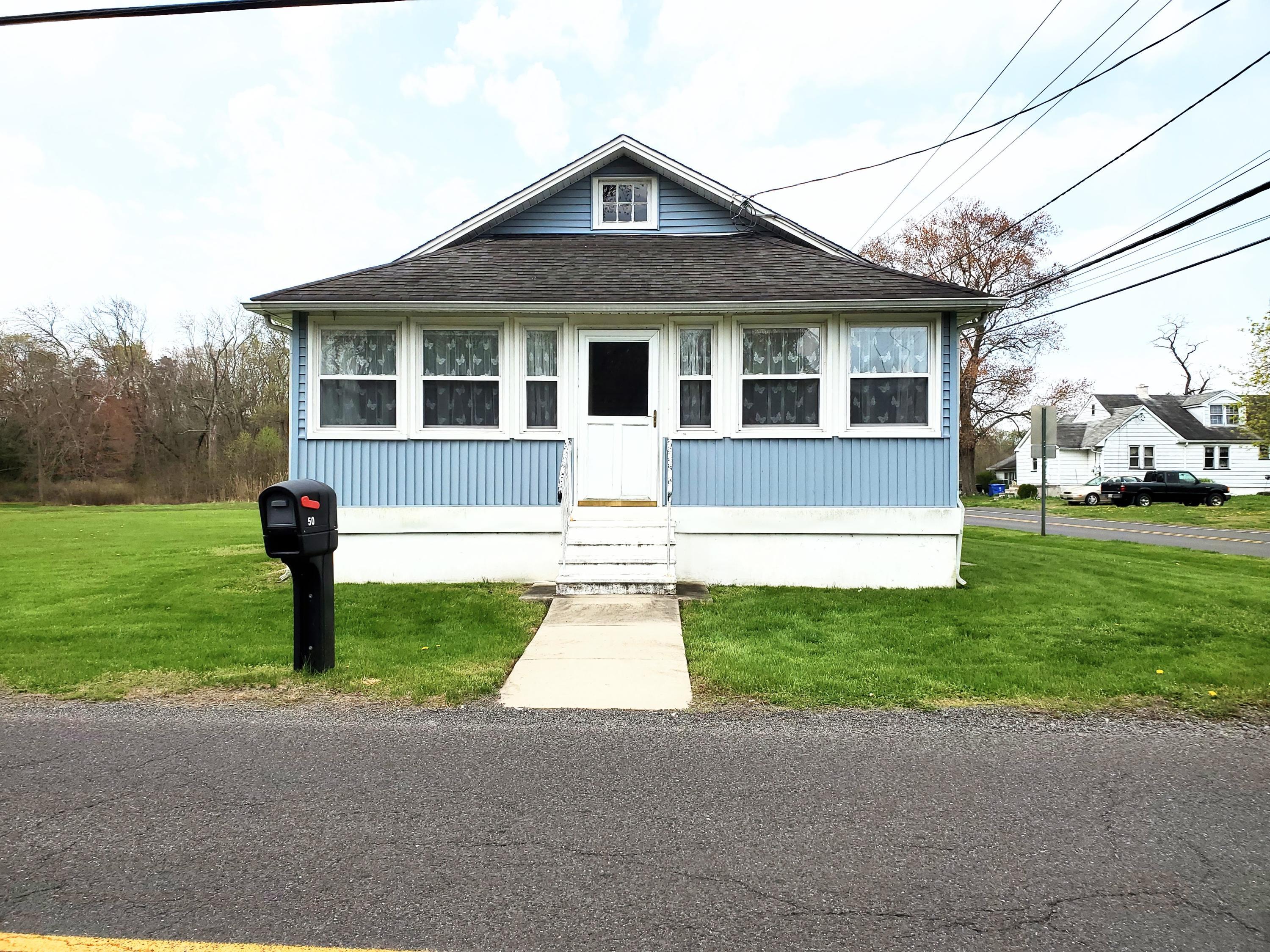 50 Hawkin Road Medford, NJ 08055 - Photo 1 of 28 a front view of a house with a yard