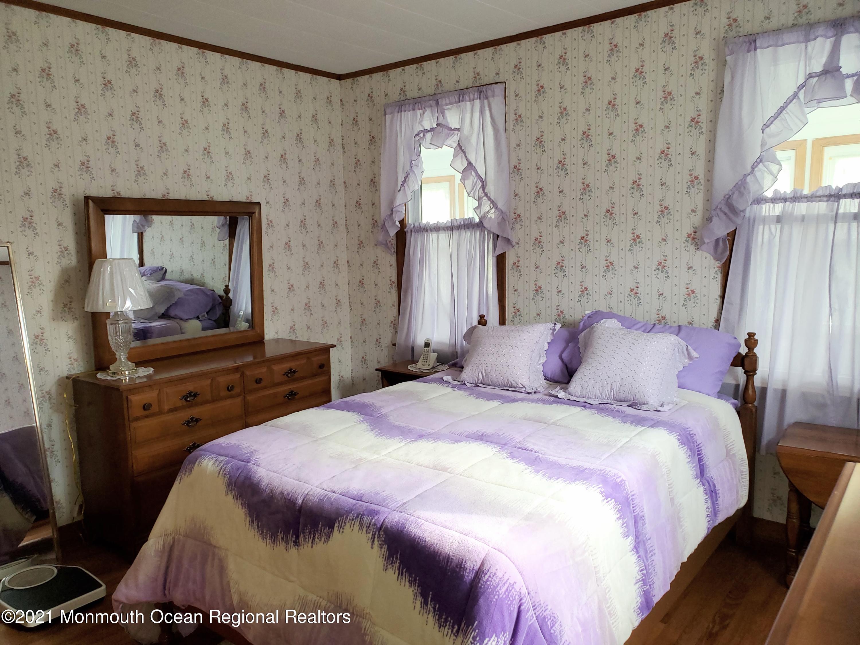 50 Hawkin Road Medford, NJ 08055 - Photo 11 of 28 a bedroom with a bed and a flat tv screen on dresser