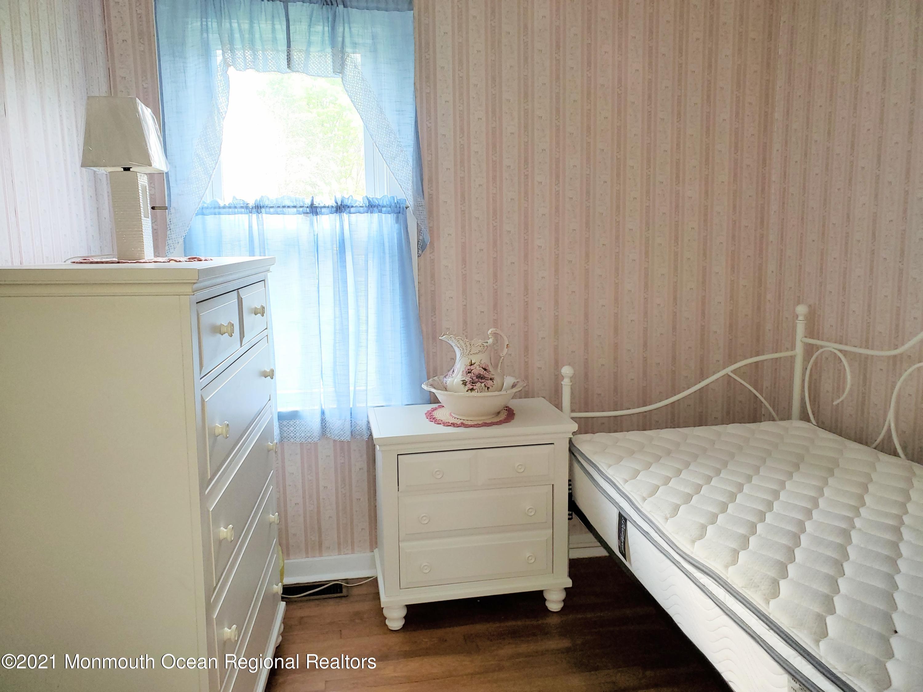 50 Hawkin Road Medford, NJ 08055 - Photo 12 of 28 a bedroom with a bed and a dresser