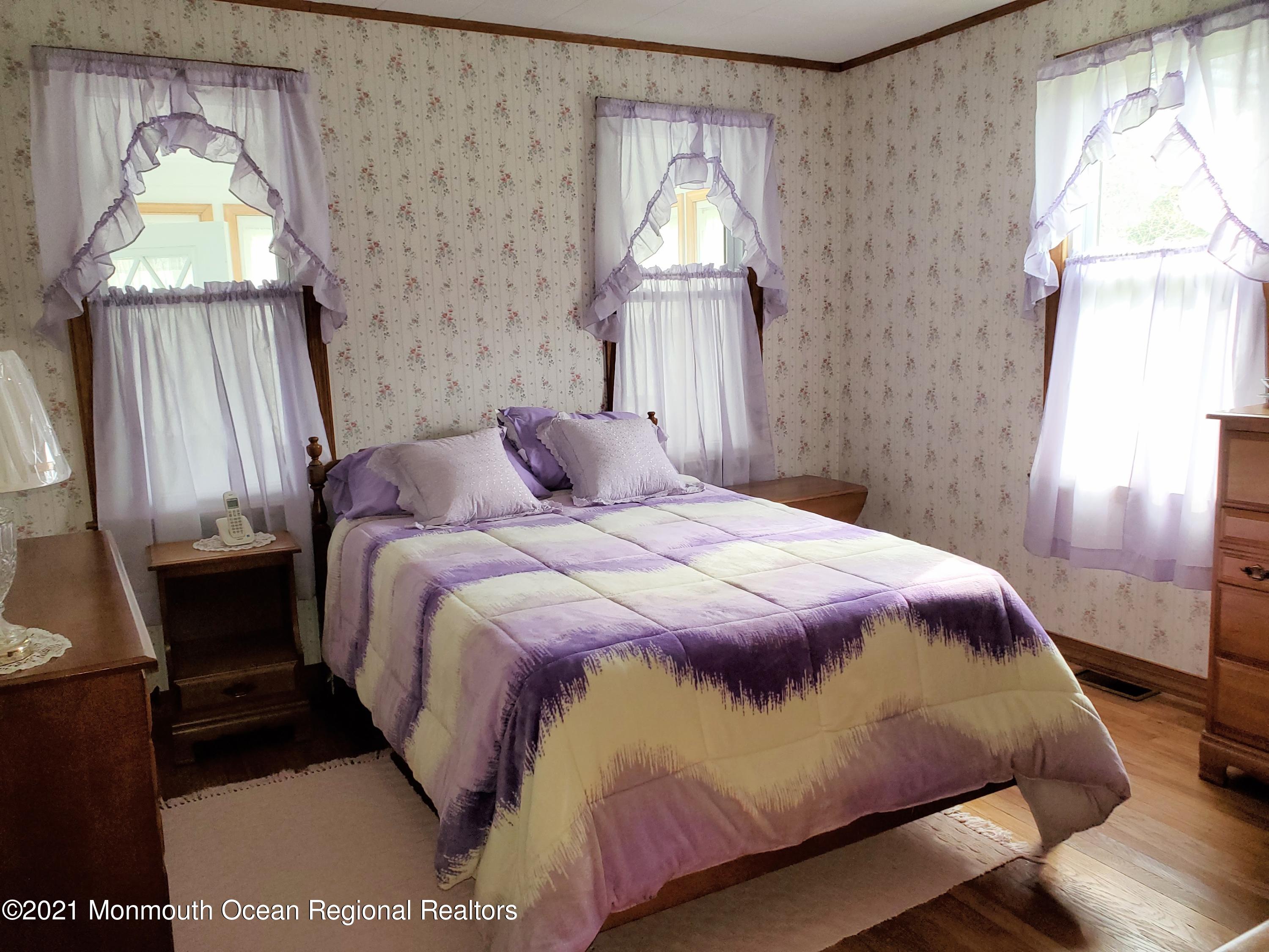 50 Hawkin Road Medford, NJ 08055 - Photo 14 of 28 a bedroom with a bed and a window