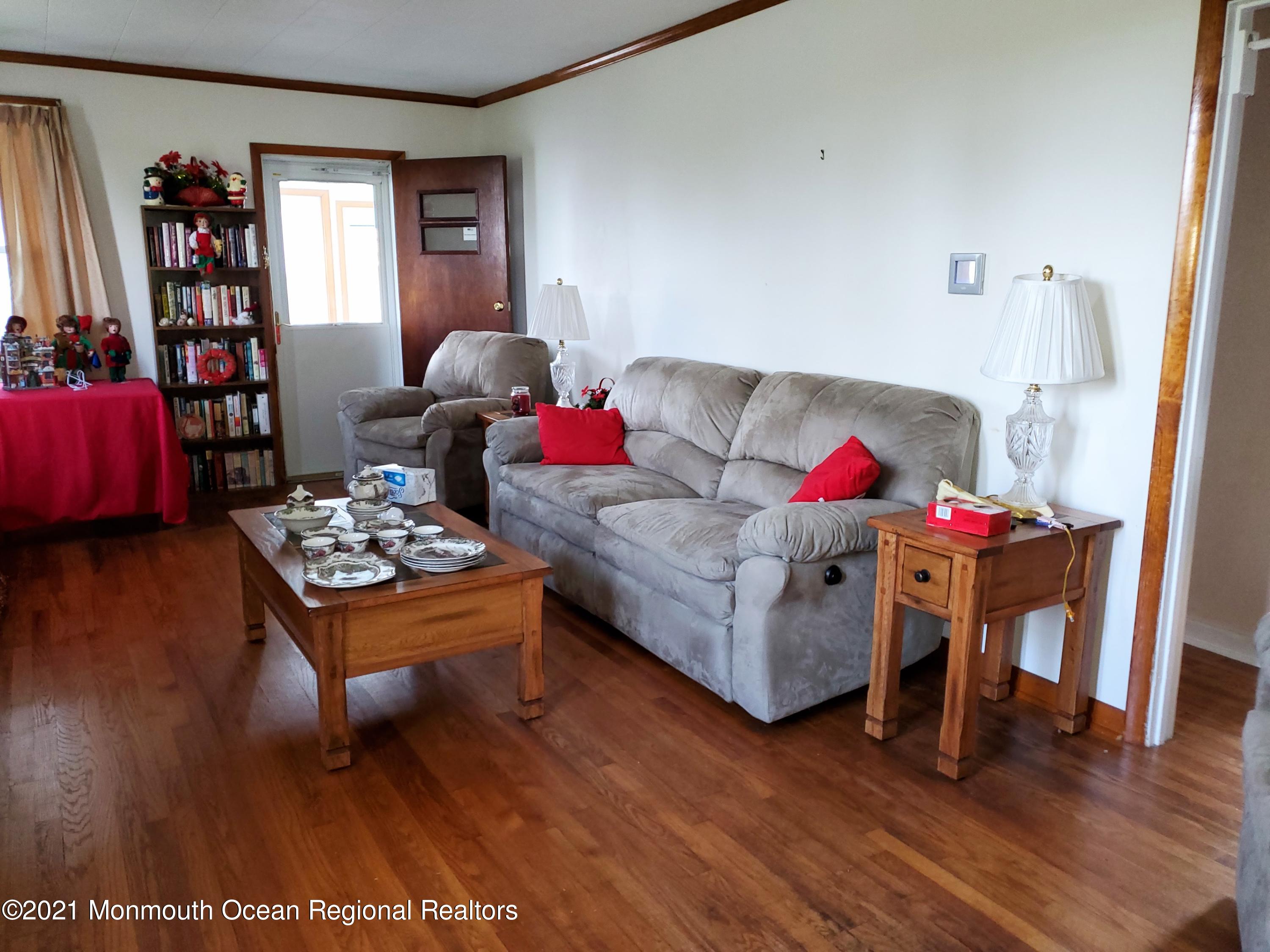 50 Hawkin Road Medford, NJ 08055 - Photo 15 of 28 a living room with furniture and a book shelf