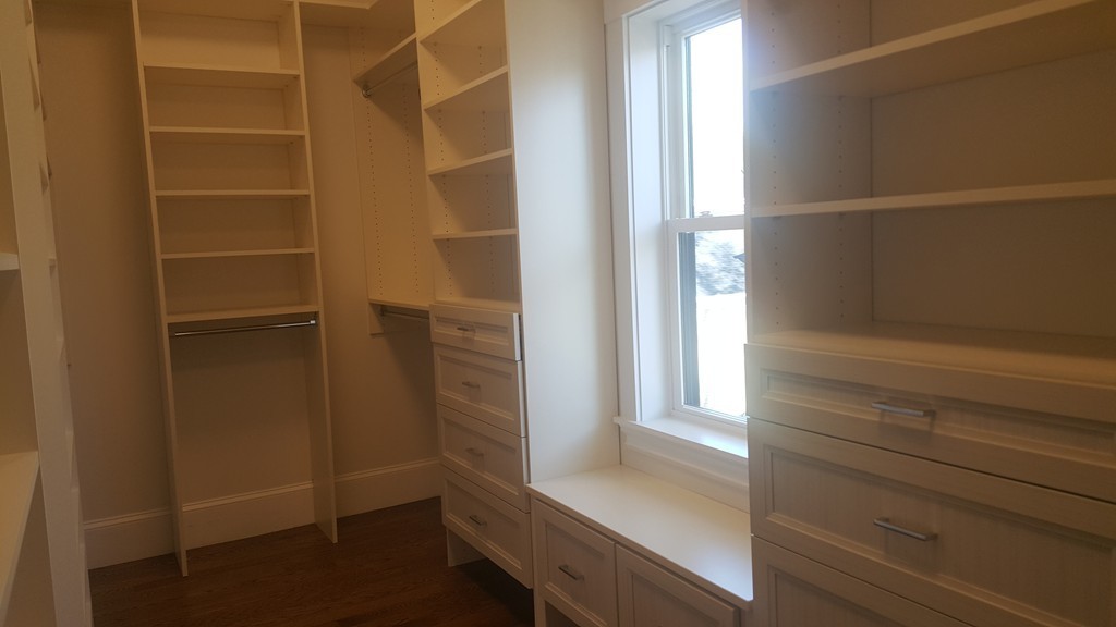 62 Maple Street, Unit 2 Needham, MA 02492 - Photo 15 of 25 a view of walk in closet with empty racks