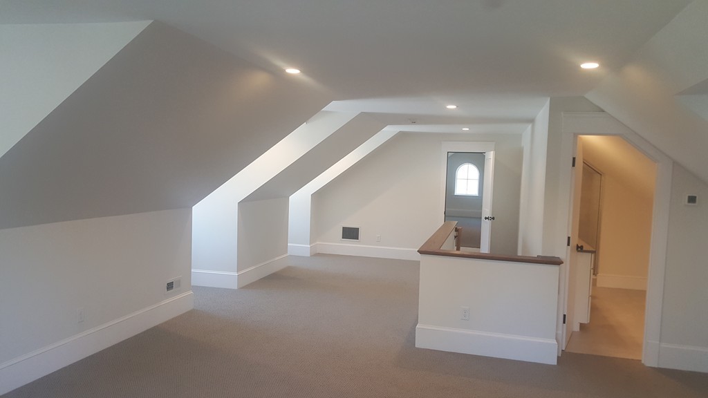 62 Maple Street, Unit 2 Needham, MA 02492 - Photo 22 of 25 wooden floor in an empty room and a mirror