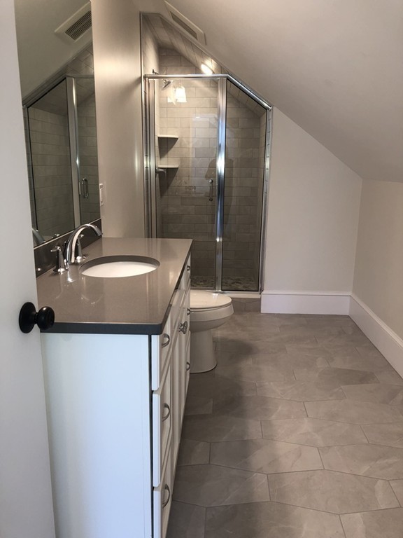 62 Maple Street, Unit 2 Needham, MA 02492 - Photo 25 of 25 a bathroom with a sink a toilet and shower