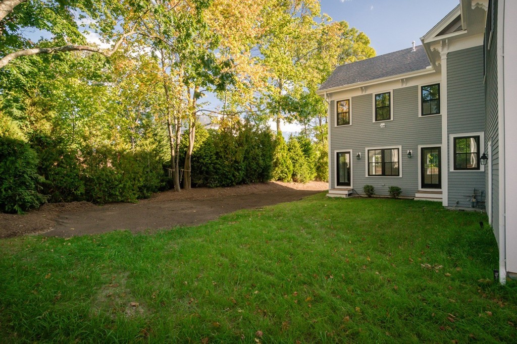 62 Maple Street, Unit 2 Needham, MA 02492 - Photo 3 of 25 a view of a house with backyard and garden