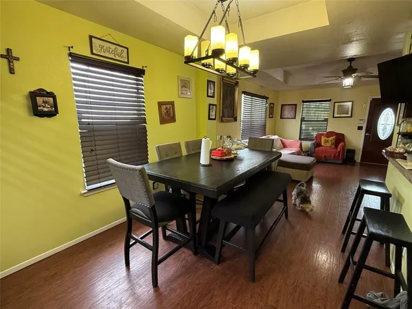 a view of a dining room with furniture and wooden floor