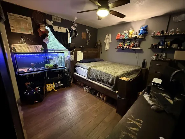 a bed room with furniture and a chandelier