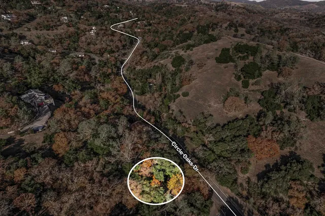 a backyard of a house with a lots of trees