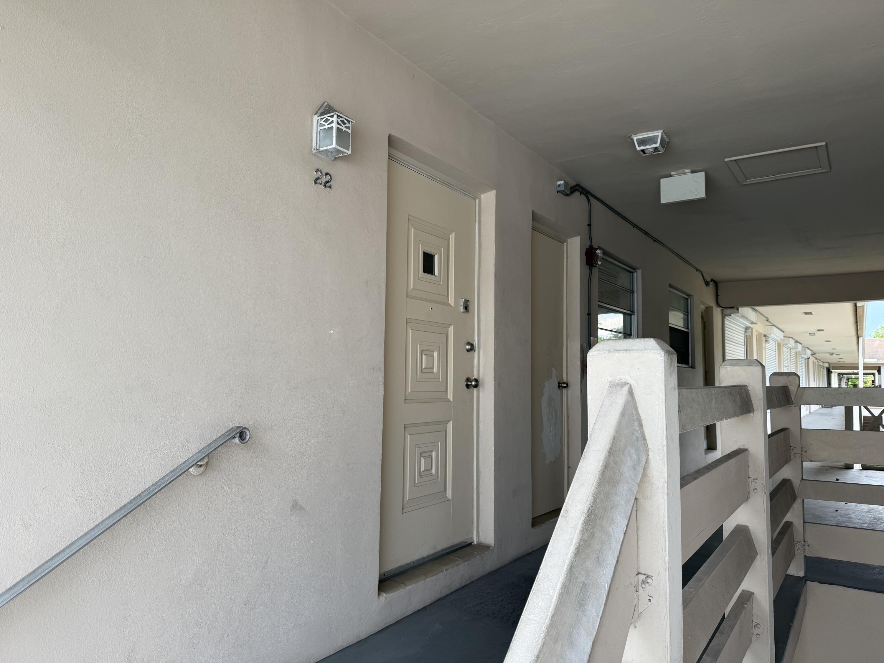 3600 Jackson Street, Unit 22 Hollywood, FL 33021 - Photo 7 of 8 a view of a hallway with wooden floor and entryway