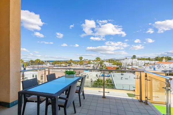 a view of a balcony with chairs