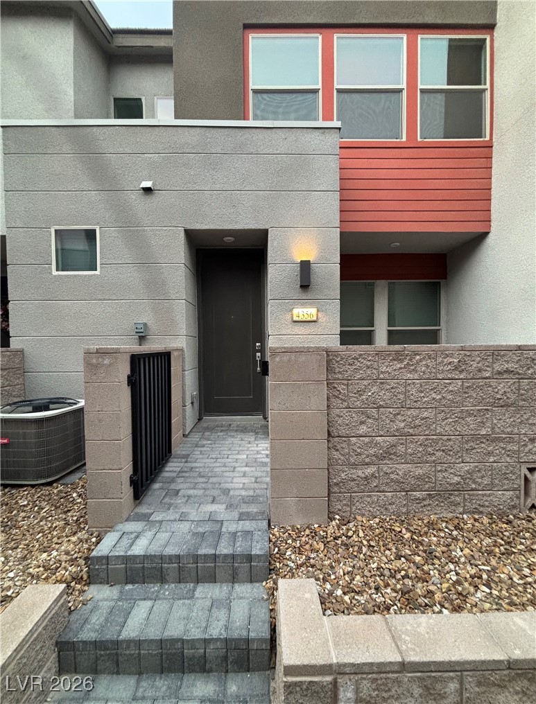 Property entrance with stucco siding