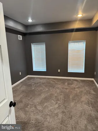 a bathroom with a sink a toilet a shower and a mirror