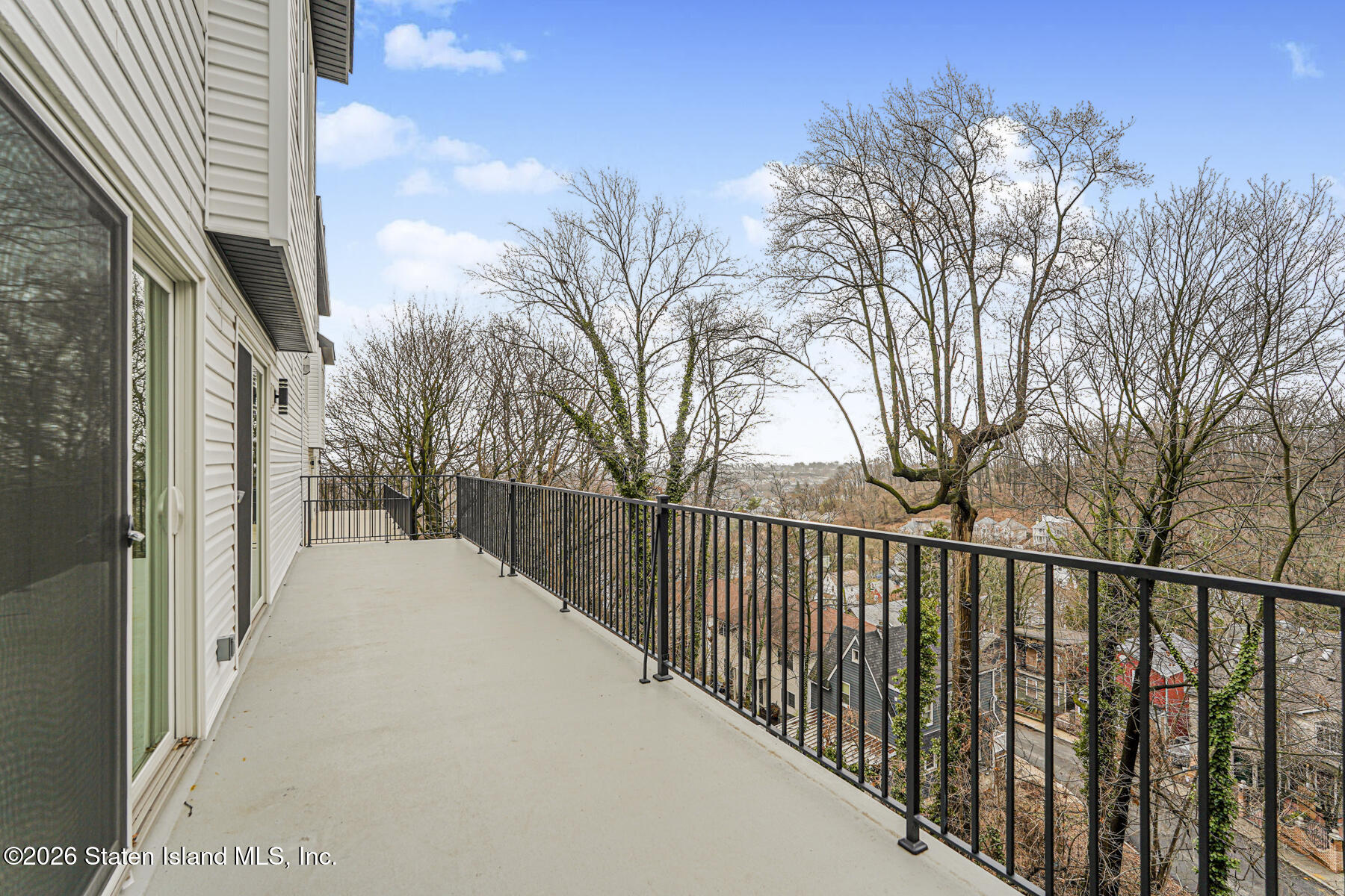 54 Cedarcliff Road Staten Island, NY 10301 - Photo 41 of 49 a view of a balcony with a trees