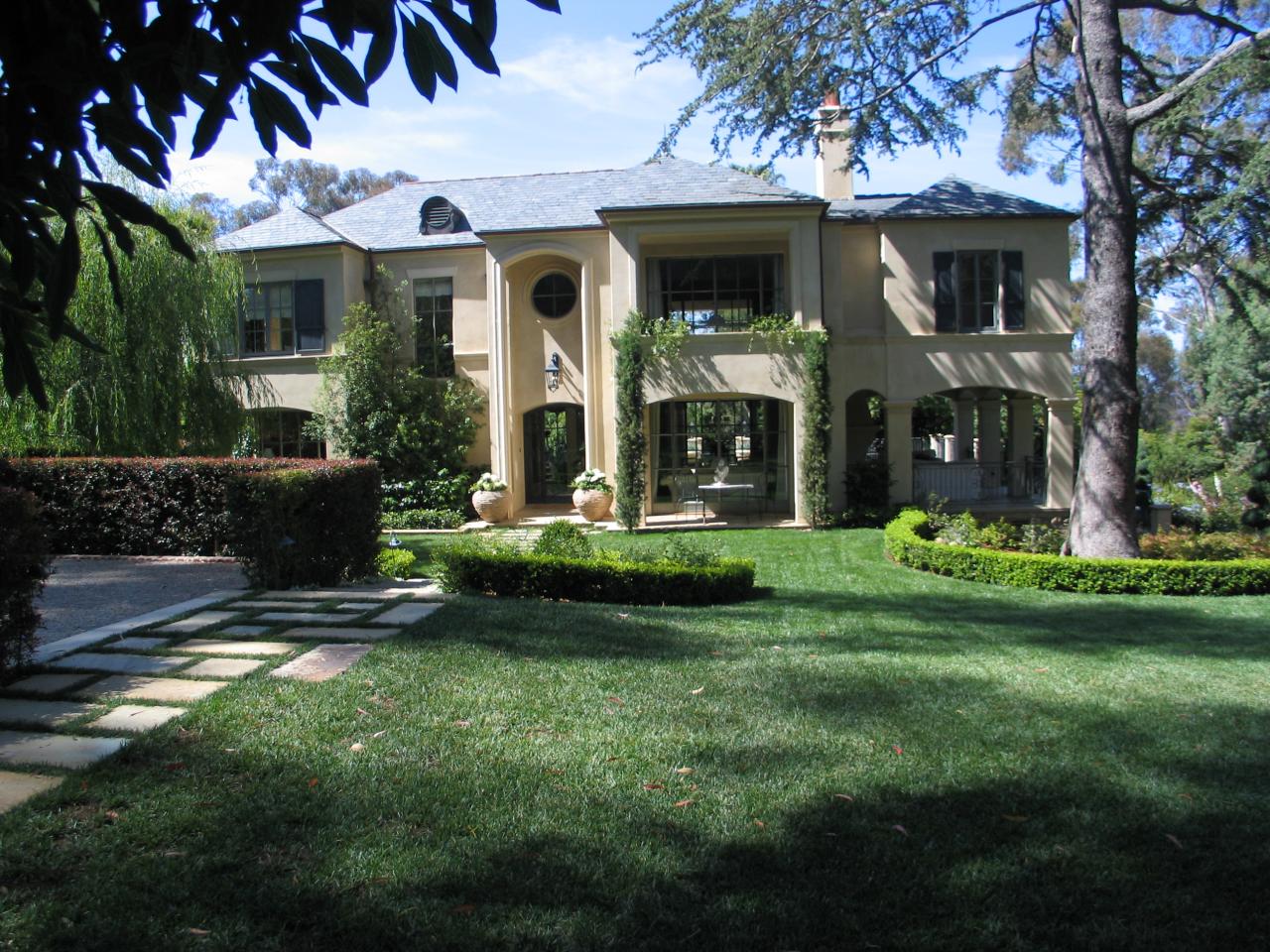 a front view of a house with garden