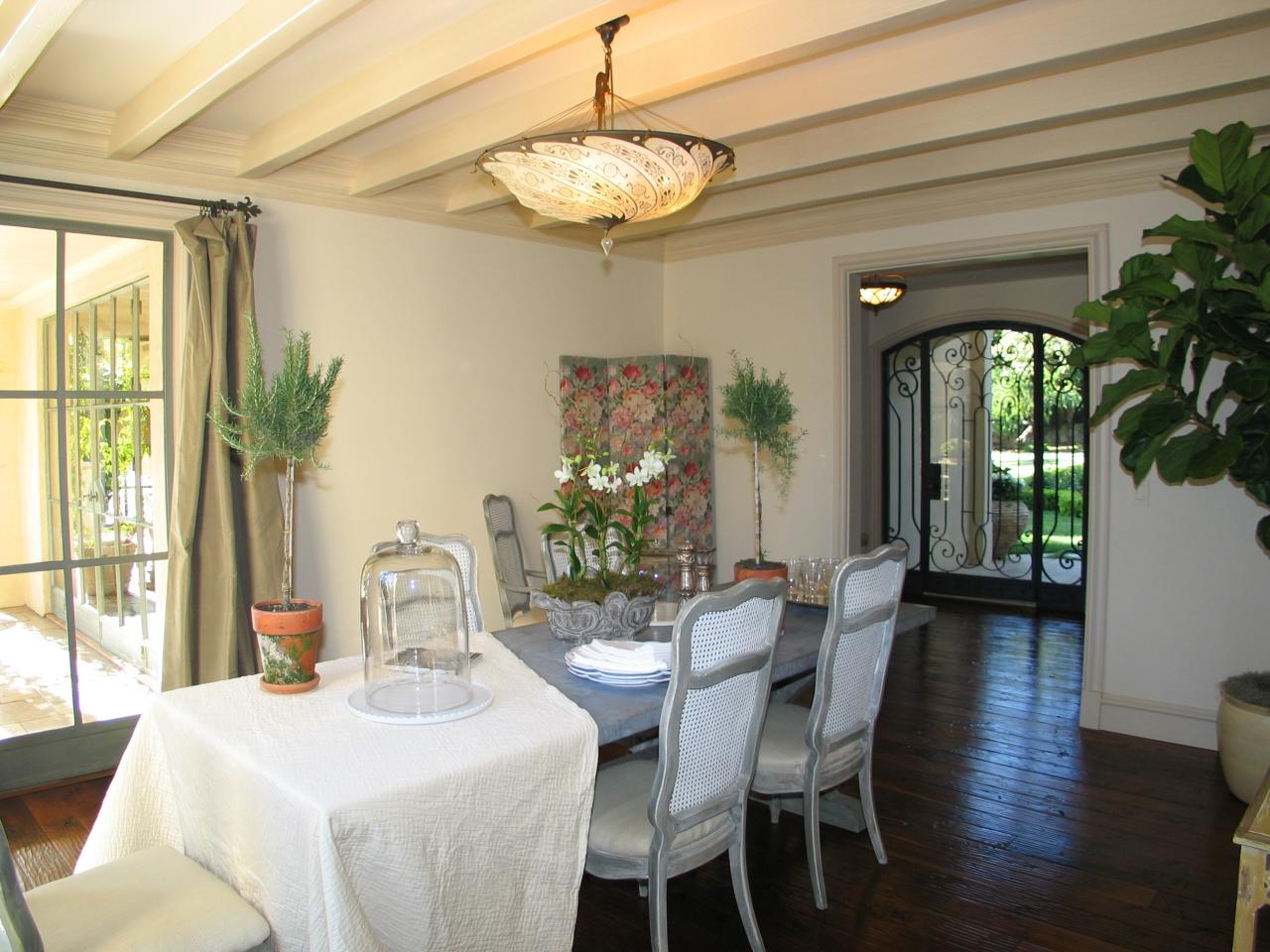 1129 High Road Santa Barbara, CA 93108 - Photo 6 of 18 a dining room with furniture a chandelier and wooden floor