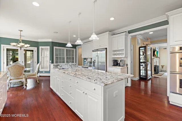 a bathroom with a granite countertop sink a toilet and a shower