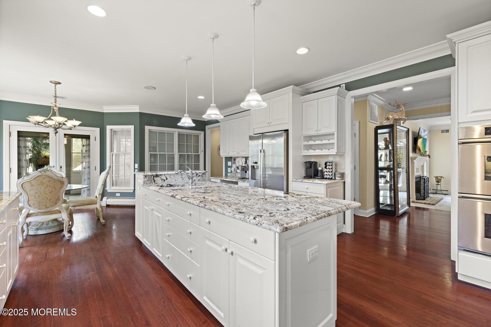 1413 Gully Road Wall, NJ 07719 - Photo 20 of 82 a large kitchen with a table and chairs