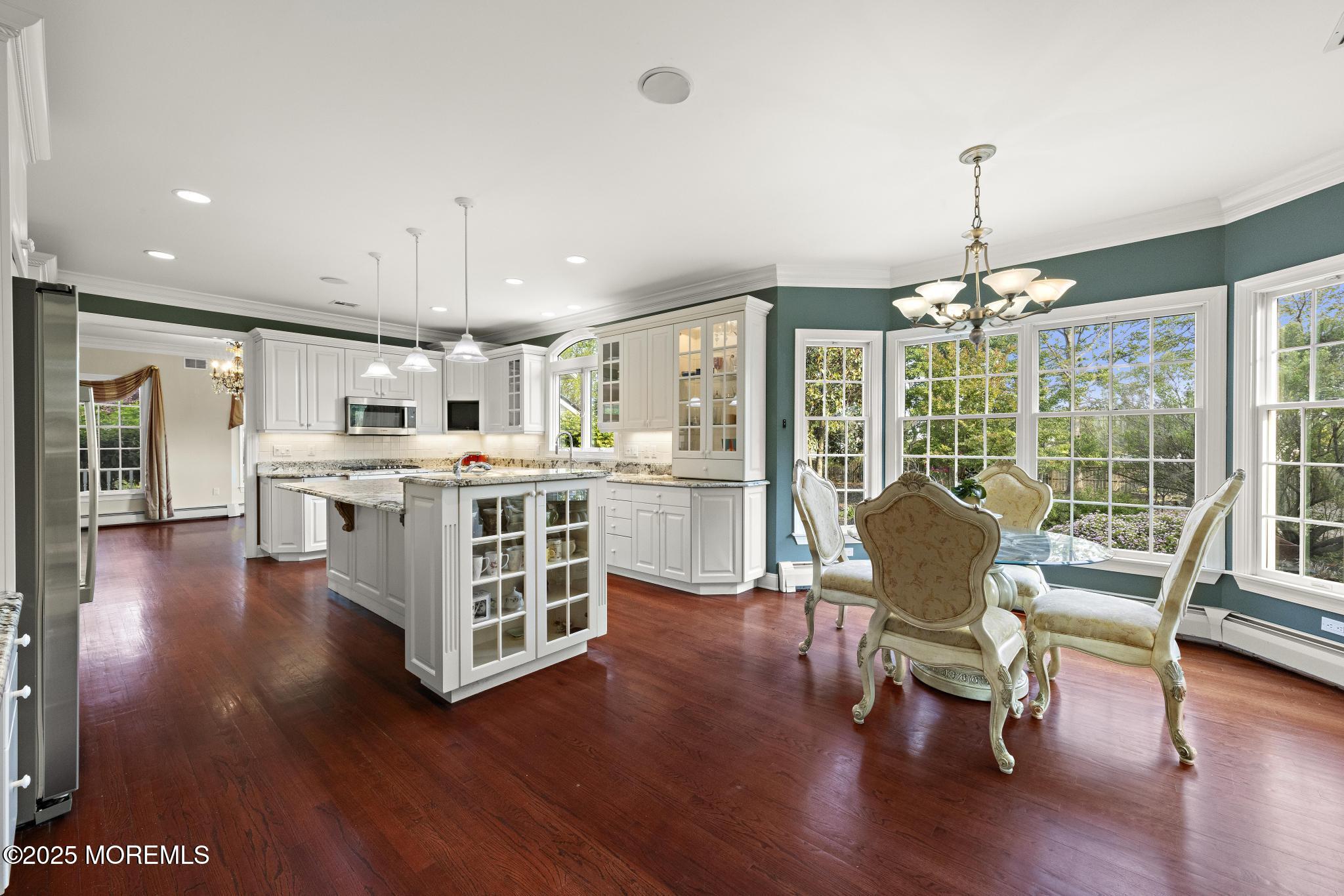 1413 Gully Road Wall, NJ 07719 - Photo 23 of 82 a living room with kitchen island furniture and a chandelier