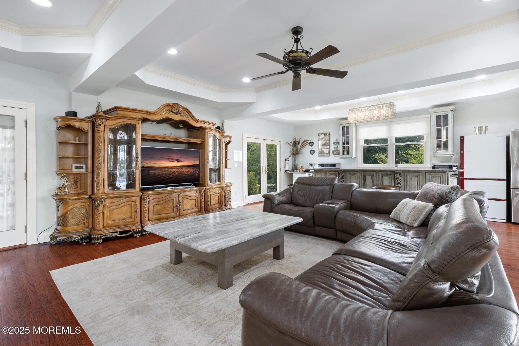 1413 Gully Road Wall, NJ 07719 - Photo 30 of 82 a living room with furniture and a flat screen tv