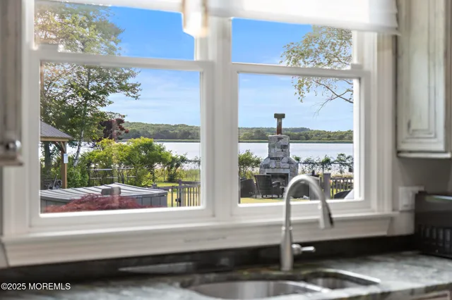 a view of a house with swimming pool and sitting area