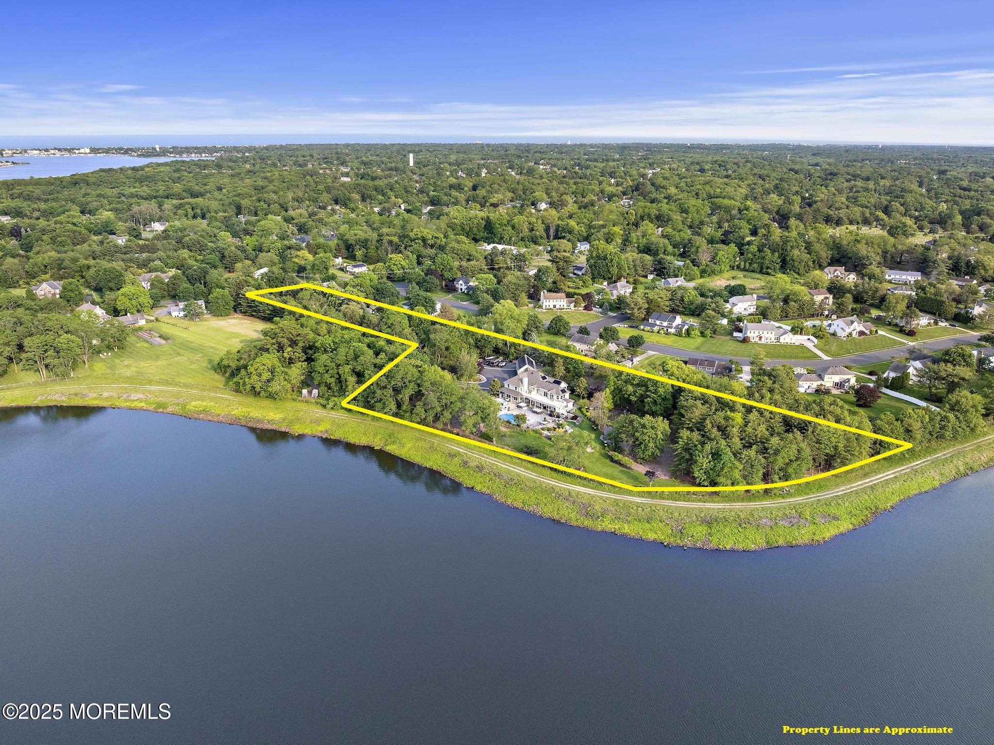 1413 Gully Road Wall, NJ 07719 - Photo 4 of 82 a view of a swimming pool with an outdoor space and seating area
